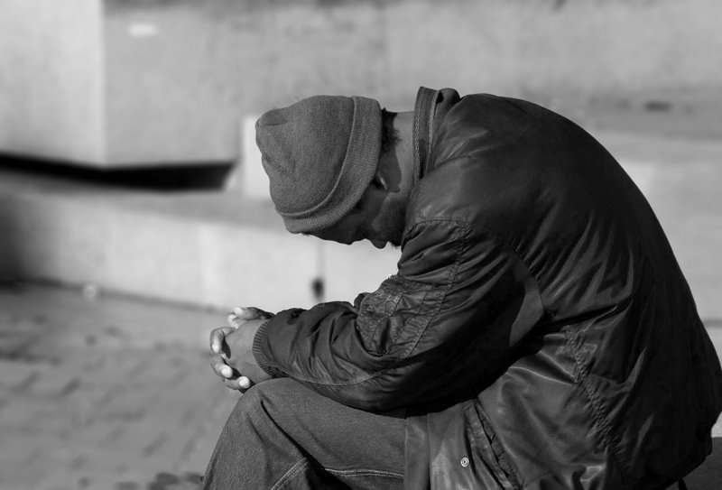 This image has an empty alt attribute; its file name is homeless-man-praying-by-javi.velazquez.jpg